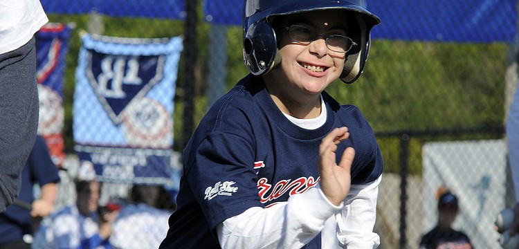 Payton Aaron couldnâ€™t contain his enthusiasm has he raced down the first base line.