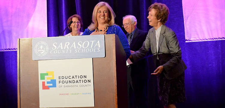 Riverview High School marine science teacher Katrin Rudge accepts the award for Teacher of the Year.