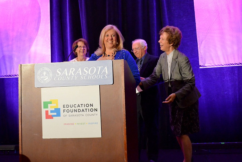 Riverview High School marine science teacher Katrin Rudge accepts the award for Teacher of the Year.