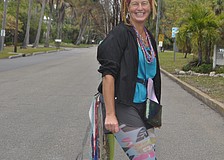 Jennifer Redding dressed as a peacock to greet shoppers as they pulled into the Village.