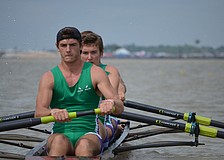 Victor Garguan, Sam Bretz, Tommy Scarpiato and Nathan Marshal row in the Boys Varsity 4.