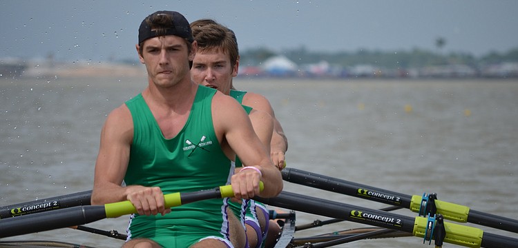 Victor Garguan, Sam Bretz, Tommy Scarpiato and Nathan Marshal row in the Boys Varsity 4.