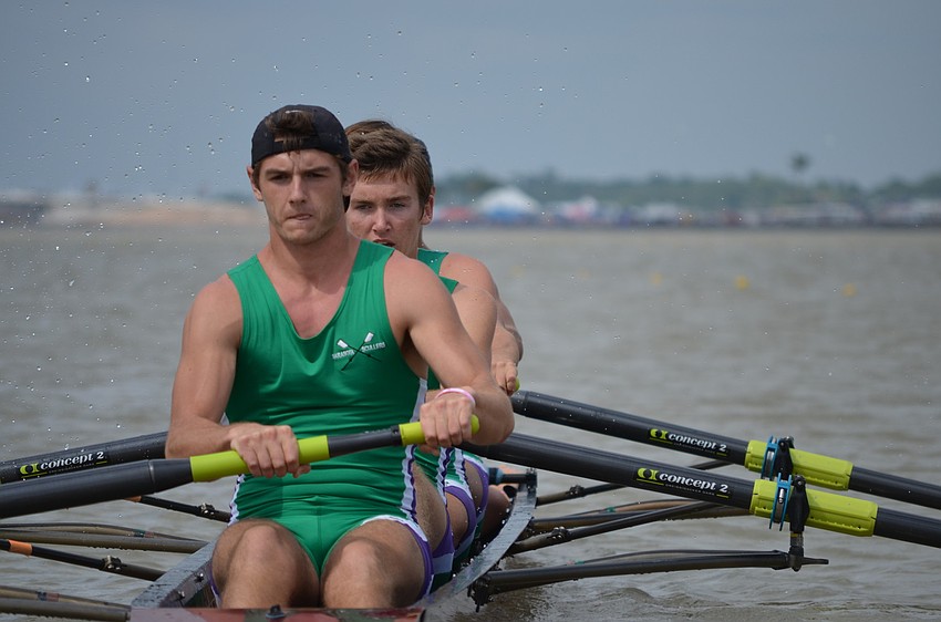 Victor Garguan, Sam Bretz, Tommy Scarpiato and Nathan Marshal row in the Boys Varsity 4.