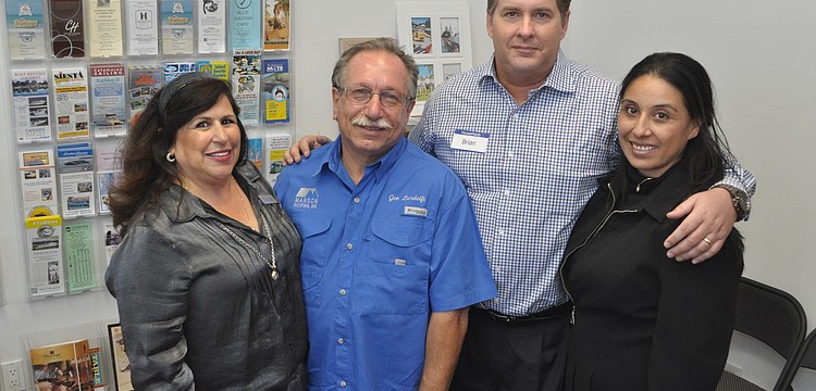 Yvonne Schloss of Sunglass Express Optical, Joe Landolfi of Manson Roofing and Brian and Sol Oâ€™Neill of House Maids