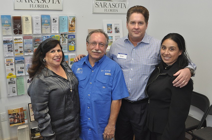 Yvonne Schloss of Sunglass Express Optical, Joe Landolfi of Manson Roofing and Brian and Sol Oâ€™Neill of House Maids