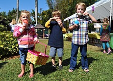 Willa Donovan, 3, Gabriel Redman, 5, and Henry Donovan, 5, enjoy their sno-cones.