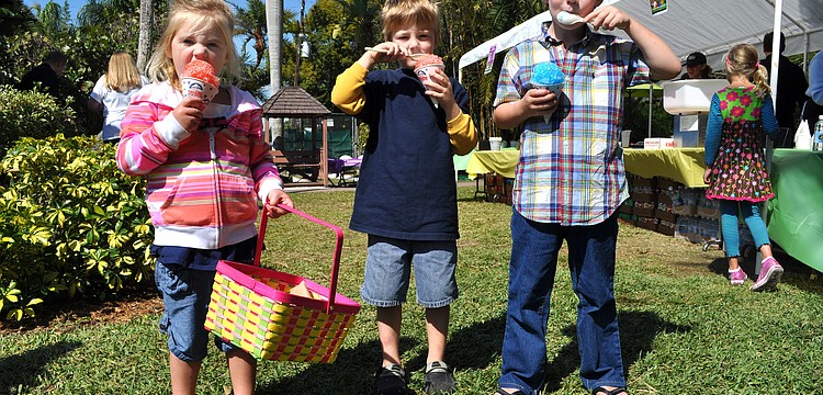 Willa Donovan, 3, Gabriel Redman, 5, and Henry Donovan, 5, enjoy their sno-cones.