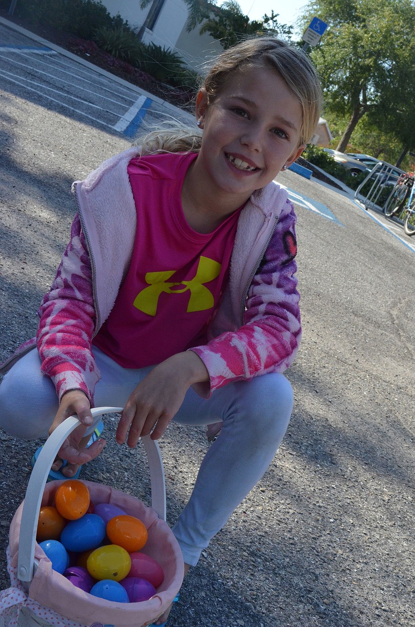 Finley Linehan shows off the eggs she found at the Easter egg hunt.