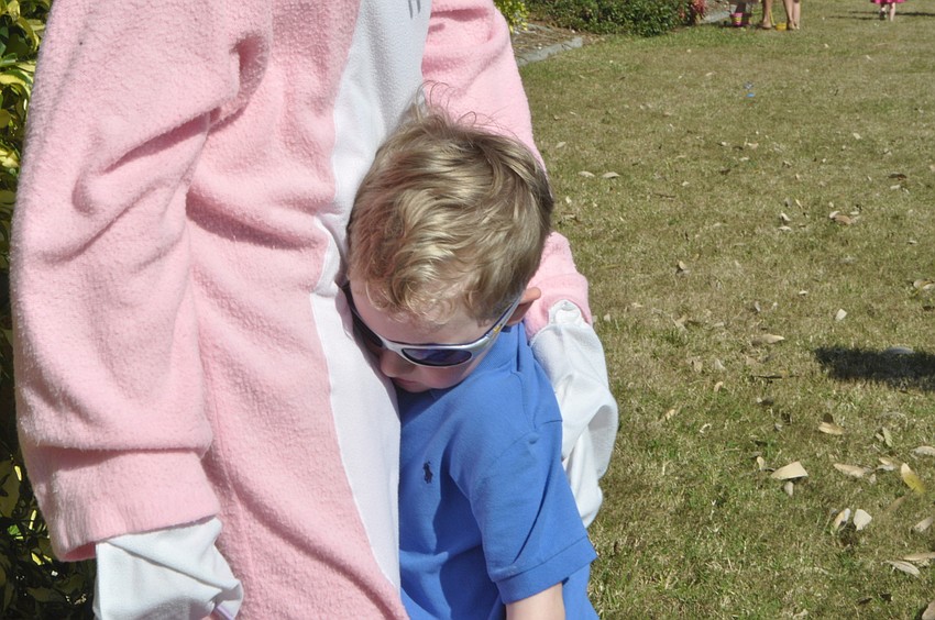 Charlie Cary, 4, hugs the Easter Bunny.