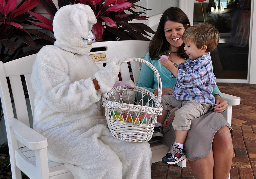 Waylon Carr, 2, shows his mom, Caroline, the Easter egg he received from the Easter Bunny.