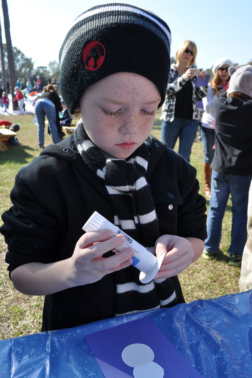 Jacob Rego, 7, decorated his snowman with a top hat, at The Tabernacleâ€™s Winter Wonderland.