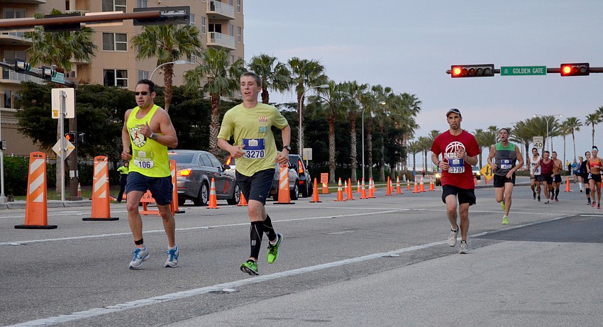 Runners make their way back over the Ringling Bridge.