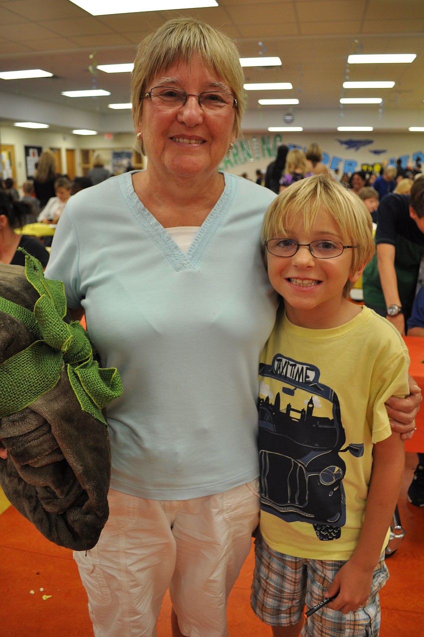 Yvonne McWilliam, pictured with her grandson, Tristan McWilliam, chose a blanket as a prize for winning a bingo game.