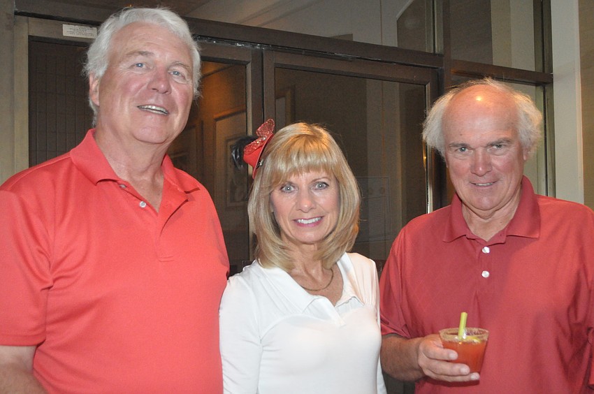 Sandy Watson with Karen and Ian MacIntosh make Caesars for guests