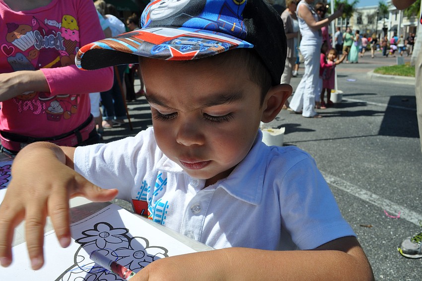 Diego Nieves, 2, colored an Easter-themed picture at the East County Observerâ€™s booth.