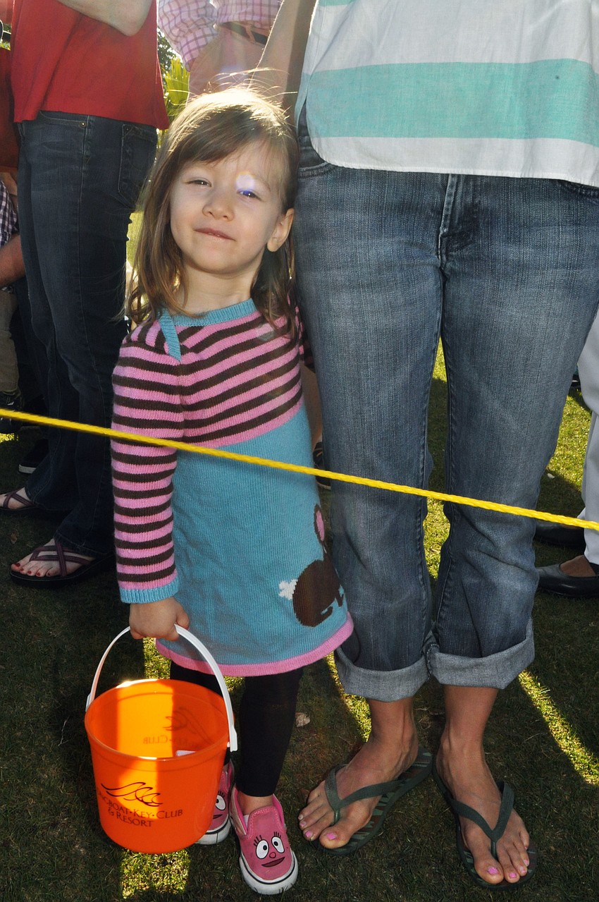 Emmy Beck, 2, waits for the hunt to begin.