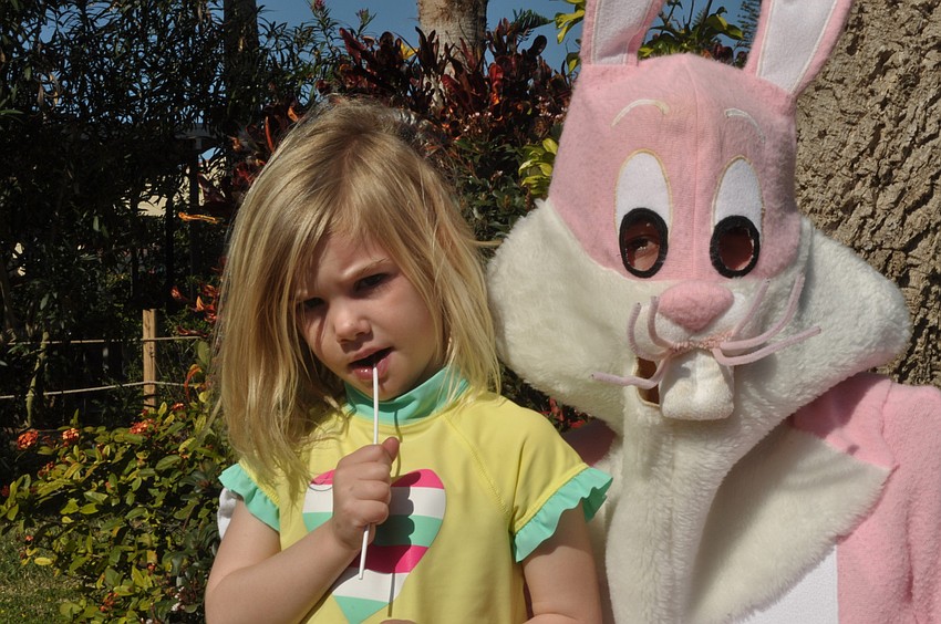 Meredith Higgins, 3, visits with the Easter Bunny.