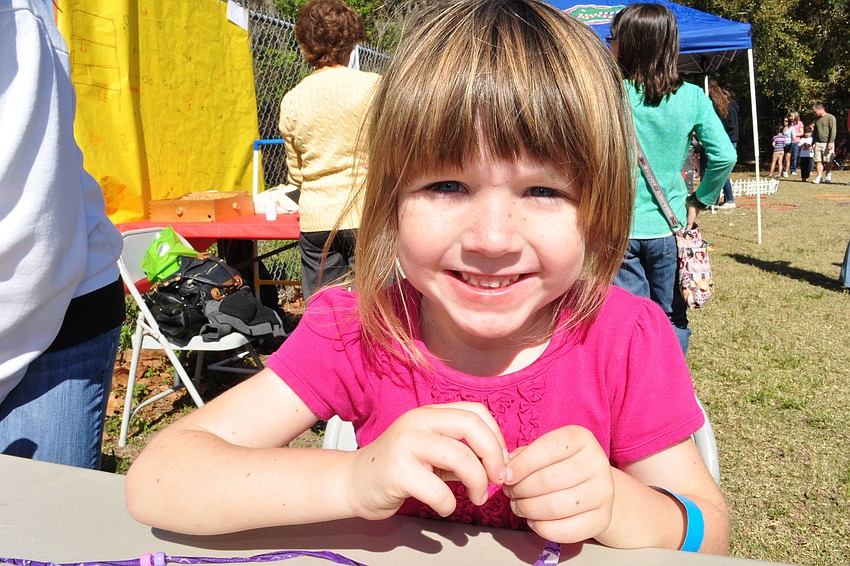Ashlyn Fisher, 4, practiced her beadwork.