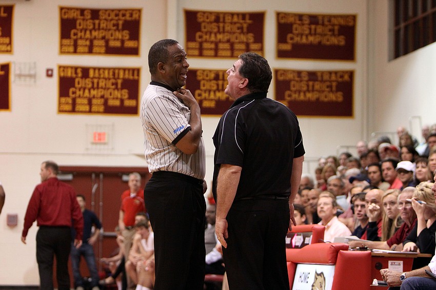 St. Petersburg Catholicâ€™s head coach Mike Moran gets into a heated argument with one of the referees during Tuesday nightâ€™s semi-final game at Cardinal Mooney.