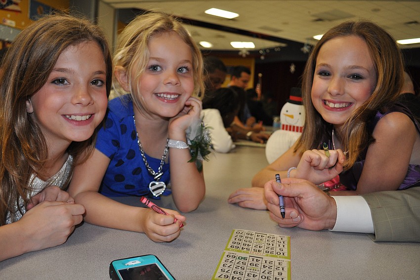 Sisters Maria Lovelace, Grace Olesen and Gina Lovelace eagerly tested their bingo skills.
