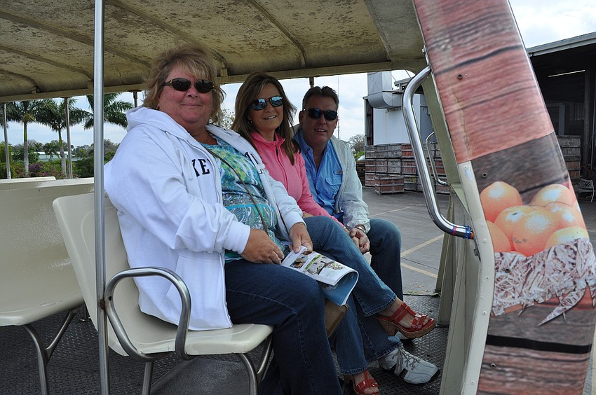 Gayle Furrow and Mary Ann and Todd Williams aboard a tram tour