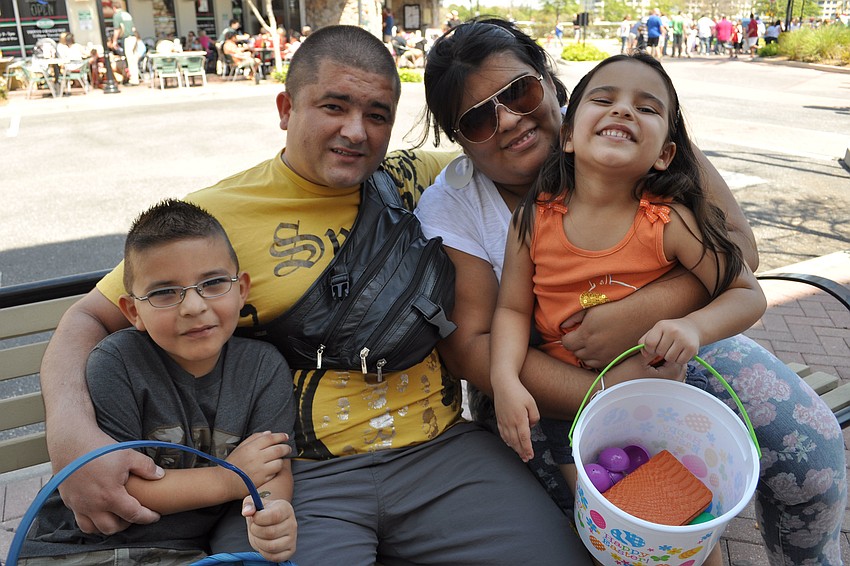 Giancarlo, Juan, Yaisuri and Jazlyn Mejia found a shady spot in which to sort through their basket of eggs.