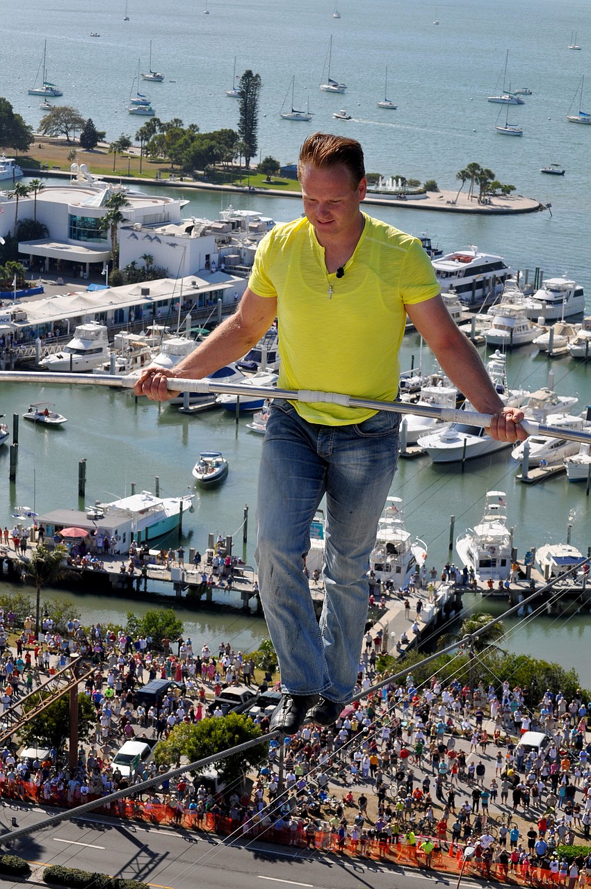 Wallenda smiles and jokes as he approaches the rooftop.