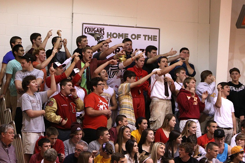 Students from Cardinal Mooney try to distract St. Petersburg Catholicâ€™s players while cheering on Cardinal Mooneyâ€™s players during Tuesday nightâ€™s semi-final game.