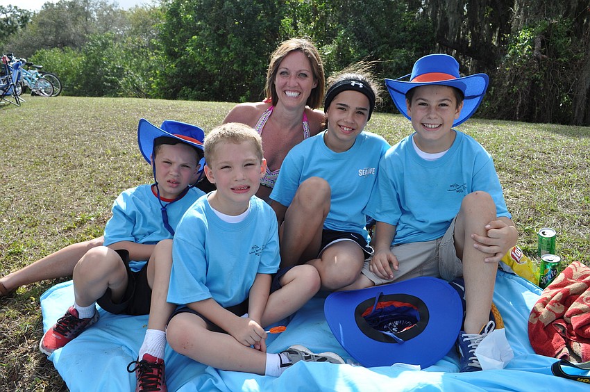 Rocco, Jaxsen, Stephanie and Savannah Ericksen and cousin T.J. Davis found a shady spot in which to rest.