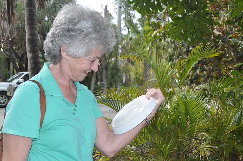 Donna Pullian checks out a plate.