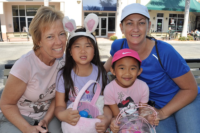 Hope Tudor and her friend Gracie Lapointe swapped candy stashes. They are pictured with their moms, Debbie Tudor, left, and Kimberly Lapointe, right.
