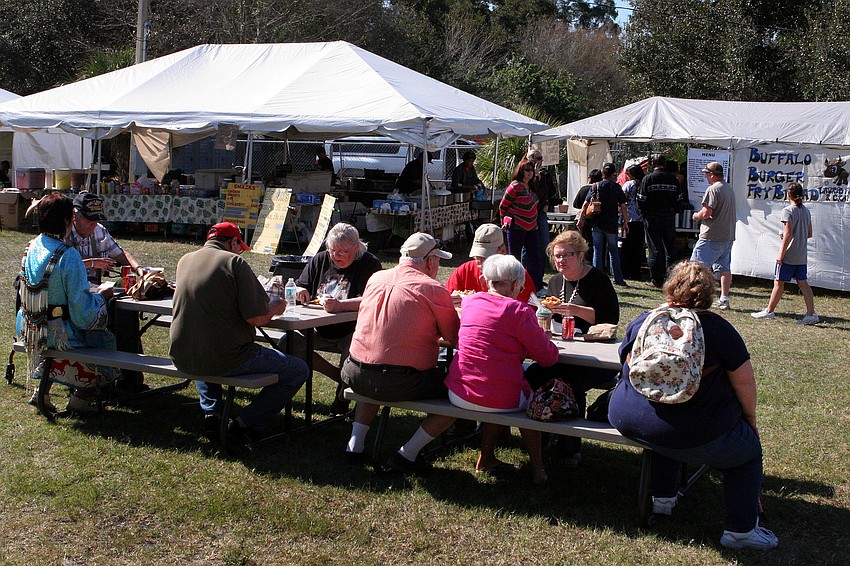 People enjoyed a wide variety of Native American food including buffalo burgers.