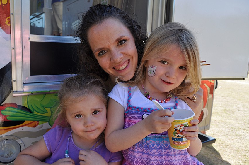Kaylee, Michelle and Ashley Crane stopped to get a sno-cone.