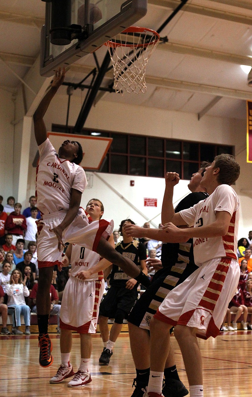 Cardinal Mooneyâ€™s Antonio Blakeley, No. 2, shoots a lay up and scores for Cardinal Mooney.