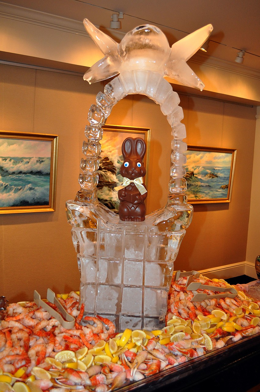 An ice sculpture of an Easter basket with a real chocolate rabbit in the middle.