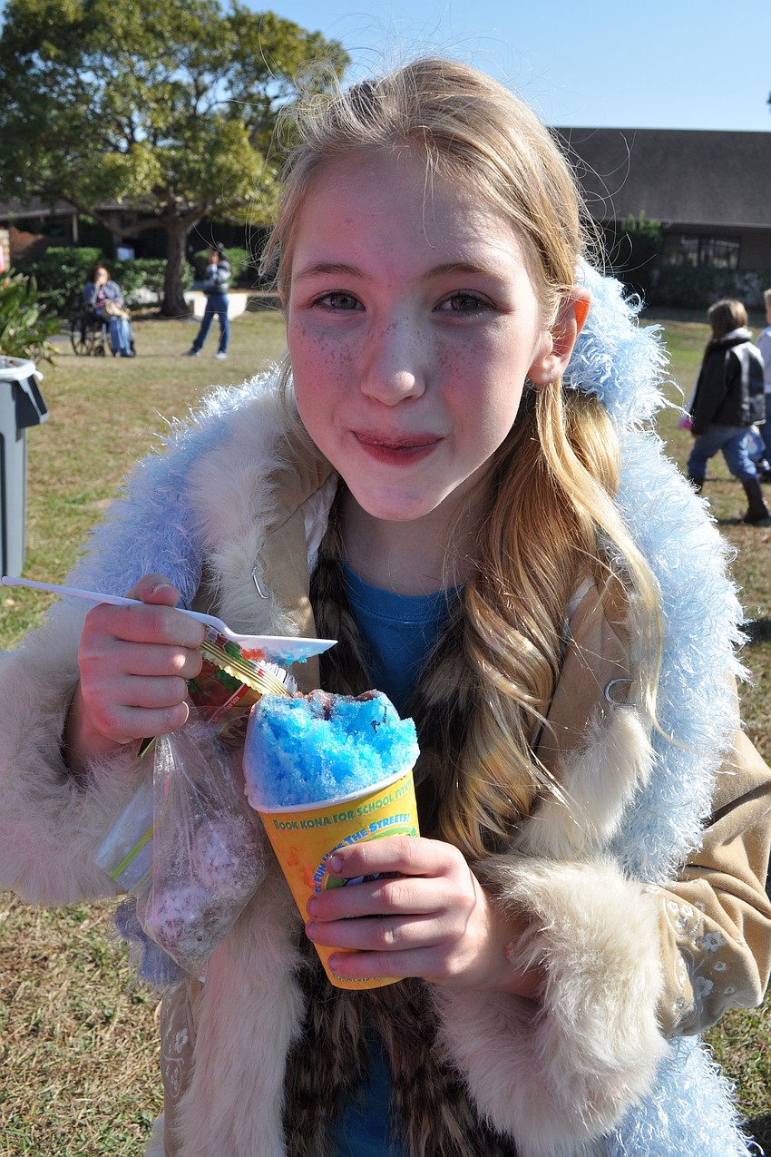Ainsley Hunihan, 9, loaded up on sweet treats after sledding at The Tabernacleâ€™s event.