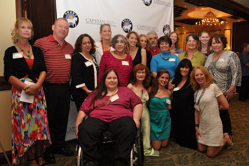 Event volunteers gather for a group photo.