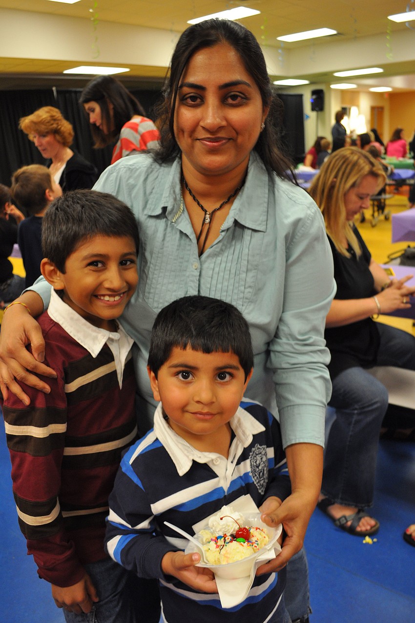 Renuka Patel enjoyed the night with her sons, Dev, left, and Shiv, right.