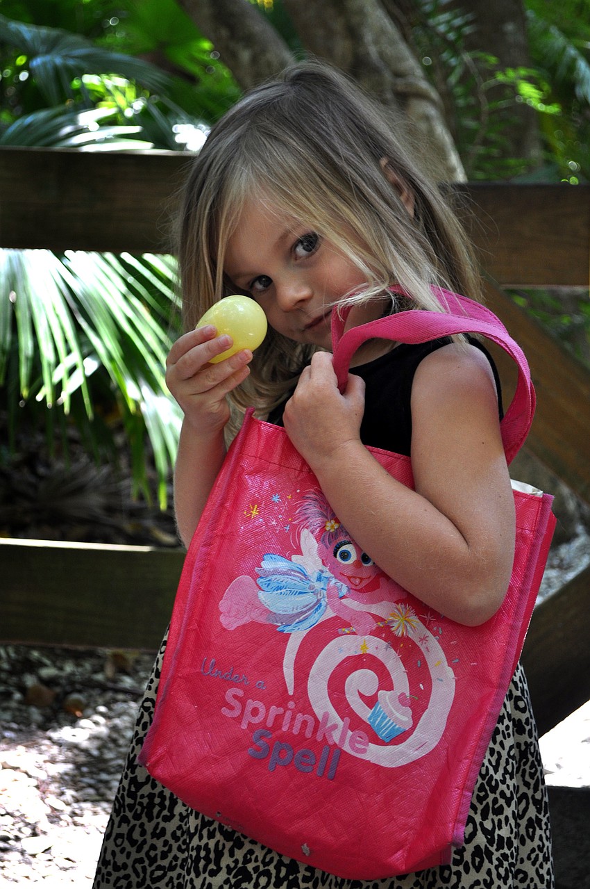 Lily Robbins, 4, shows off an egg she found.