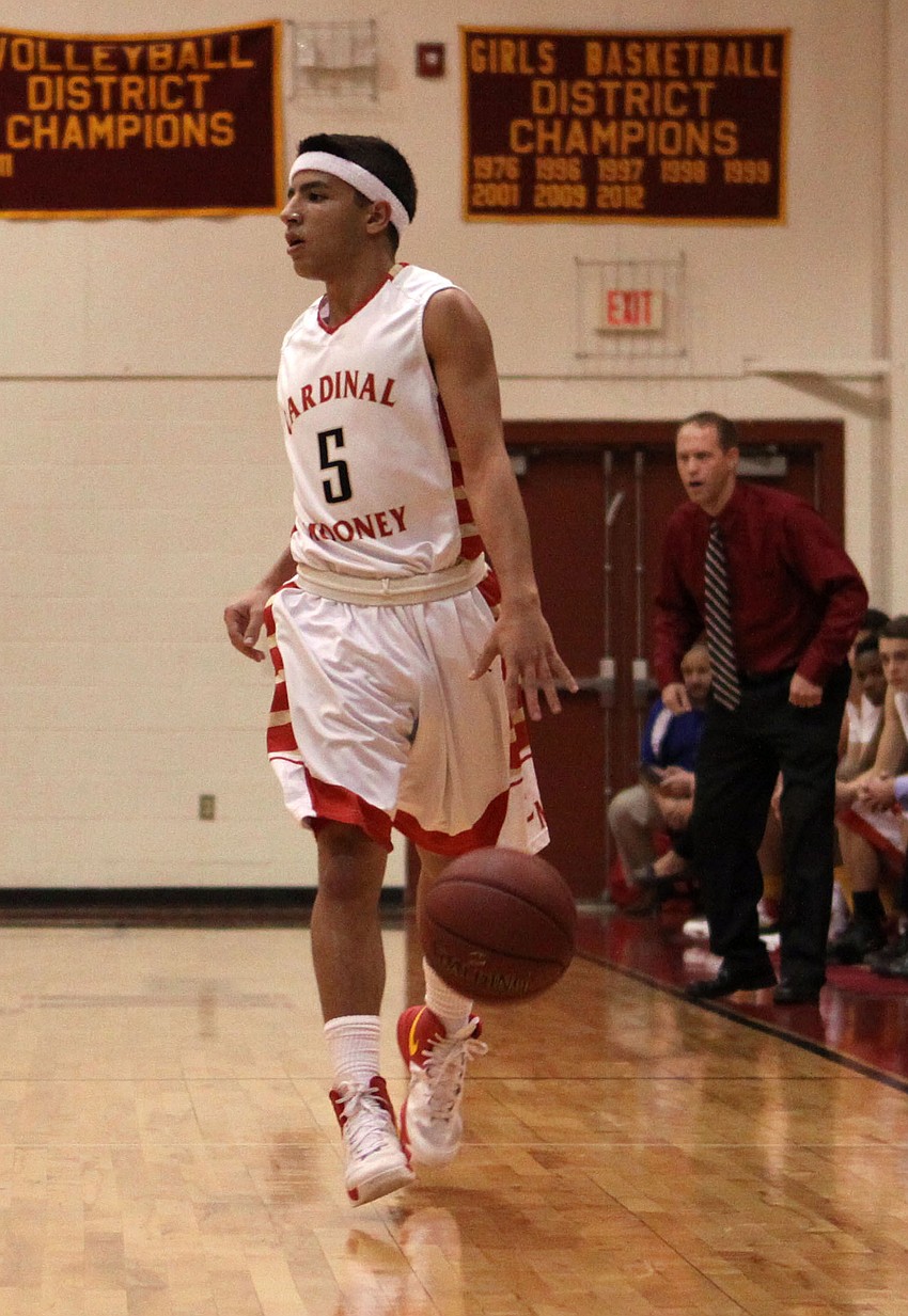 Cardinal Mooneyâ€™s Justin Najmy, No. 5, dribbles the ball while looking for an open teammate.