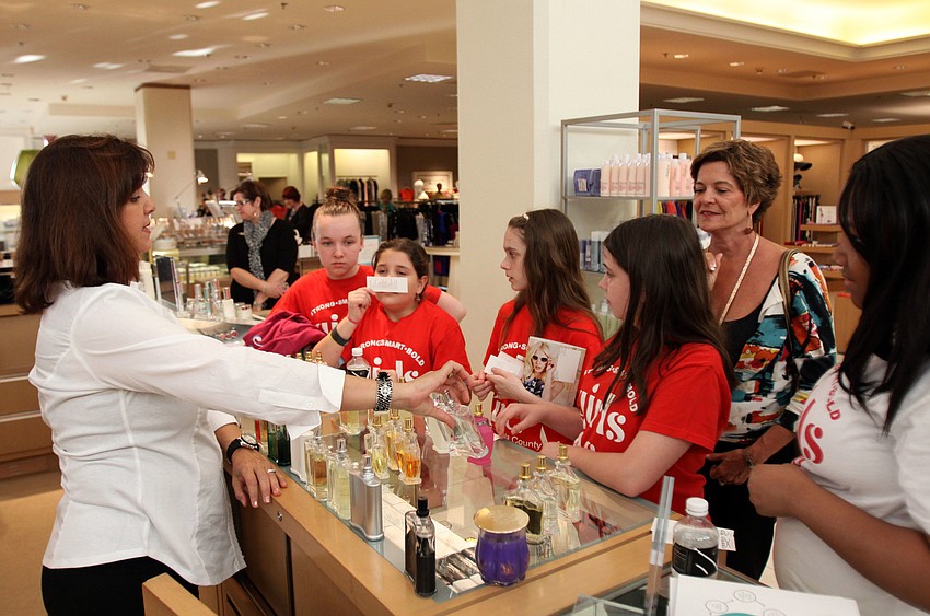 Randi Greenfield lets the girls smell a variety of different perfumes.