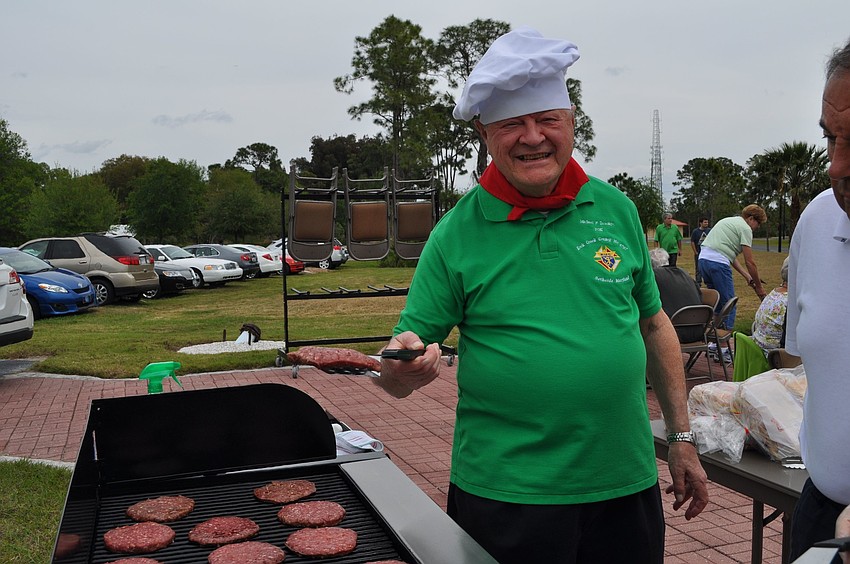Michael Iacampo shows off his grilling skills.