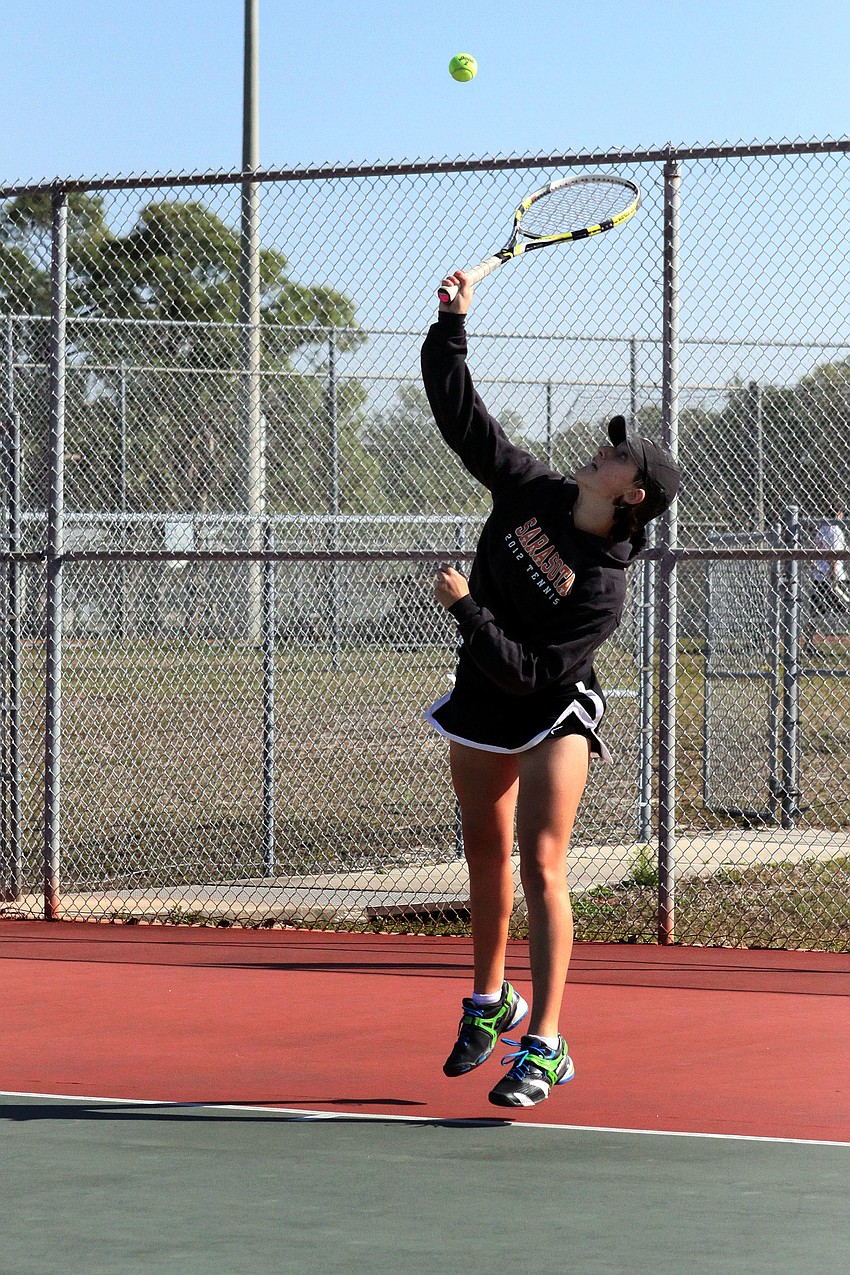 Sarasotaâ€™s Rachel Chapman serves to her opponent.