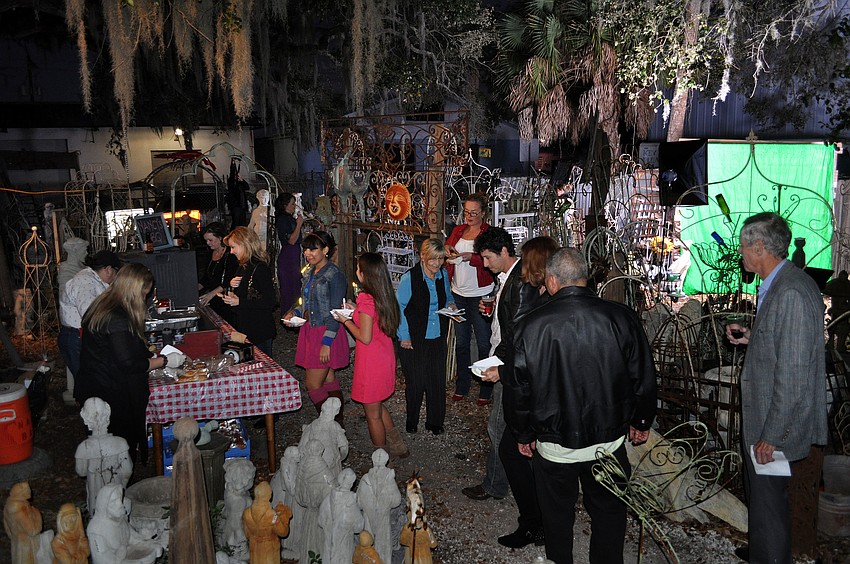 People enjoyed drinks from Shamrock Pub and food from Nancyâ€™s BBQ out in the side yard of Sarasota Architectural Salvage.
