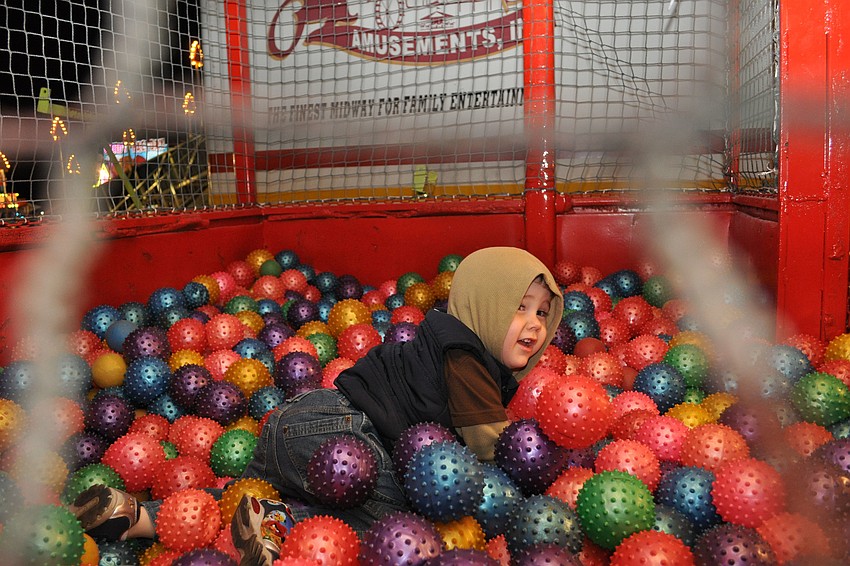 Elijah McNeal, 2, couldn't stop smiling as he made his way through the Castle Mania attraction.