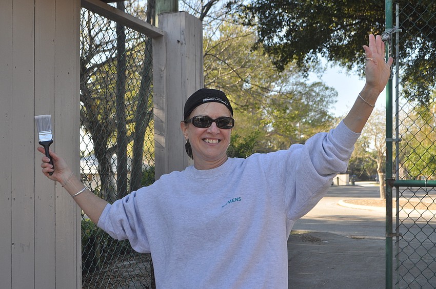 Brenda McNeils prepares to paint.