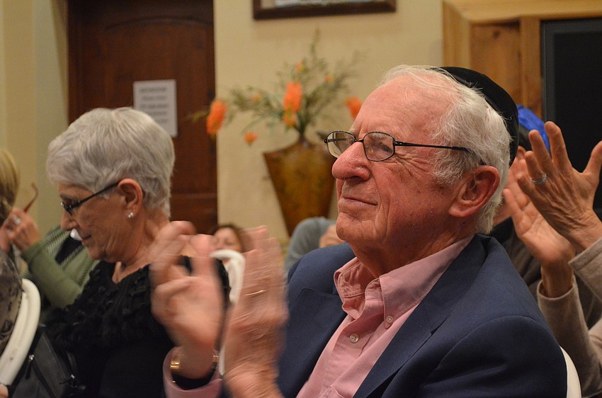 Arthur Solomon applauds the musicians for the well-played performance.