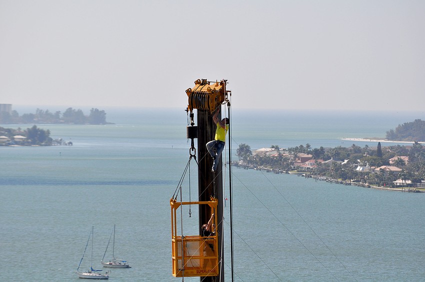 Nik Wallenda climbs out of the basket to begin his walk.