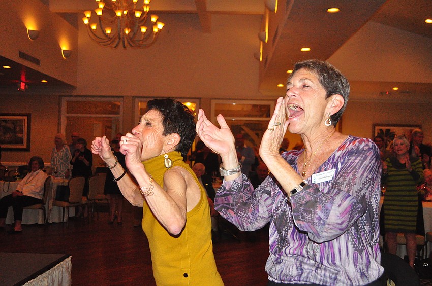 Taste of the Keys co-chair Susan Landau and Garden Club President Madelyn Spoll applaud the models.