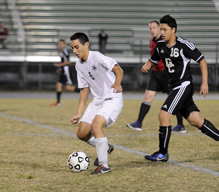 Lakewood Ranch midfielder Jimmy Jaime attempts to keep the ball away from Naples Gulf Coast.
